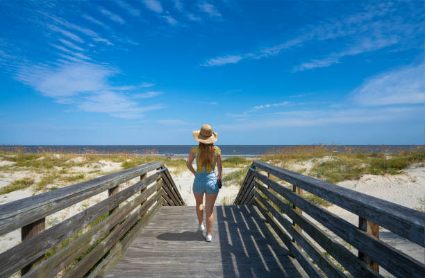istock Woman enjoying time on the beach. 1340706661