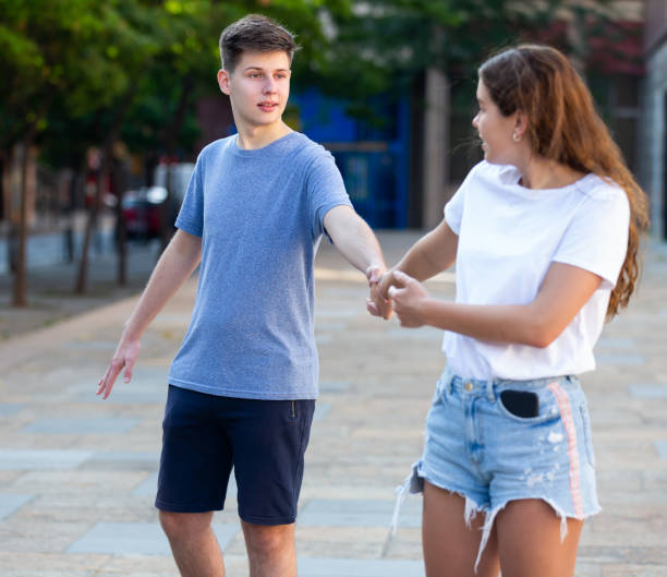 istock Teenagers walking hand in hand 1340706853