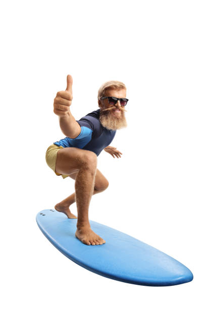 istock Bearded young man surfing and showing thumbs up 1340707849