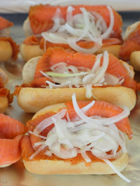 istock Delicious sandwich with fresh salmon and onion 1340708979
