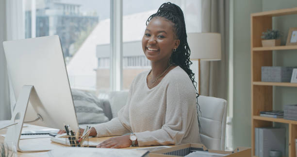 istock Shot of a young woman using a computer while working from home 1340709036