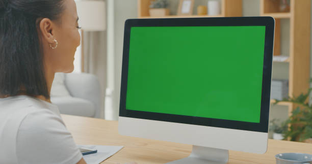 istock Shot of a young woman using a computer while working from home 1340709086