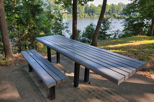 A handicap accessible picnic table at a park overlooking the Black Warrior River in Tuscaloosa, Alabama.