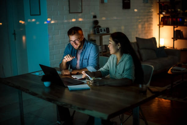 istock Happy couple working together 1340712853