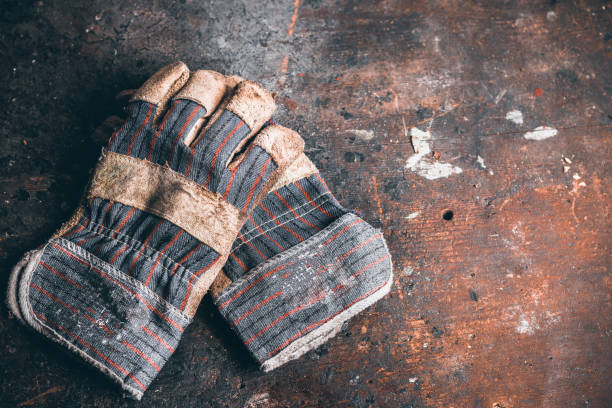 istock A pair of protection work gloves on wooden workbench. 1340713985