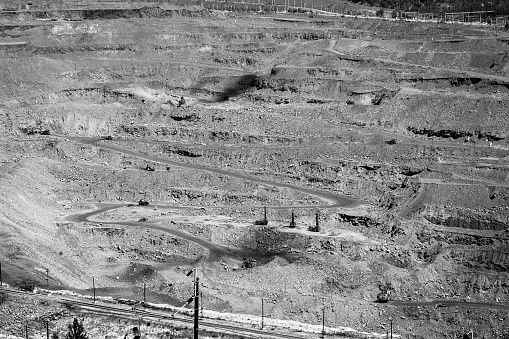 Iron ore extraction in the quarry of the Mikhailovsky mining and processing plant in Zheleznogorsk, Kursk Region. Black and white photo