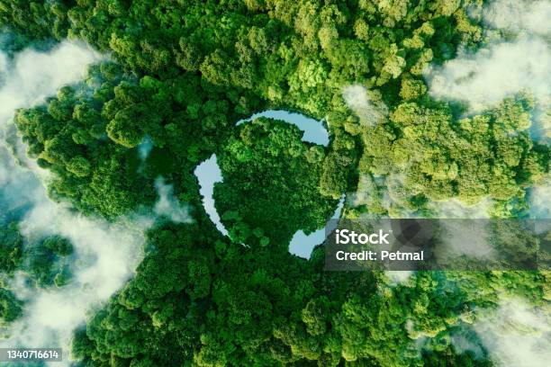 Abstract Icon Representing The Ecological Call To Recycle And Reuse In The Form Of A Pond With A Recycling Symbol In The Middle Of A Beautiful Untouched Jungle 3d Rendering Stock Photo - Download Image Now