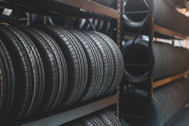A new tire is placed on the tire storage rack in the tire factory. Be prepared for vehicles that need to change tires. stock photo