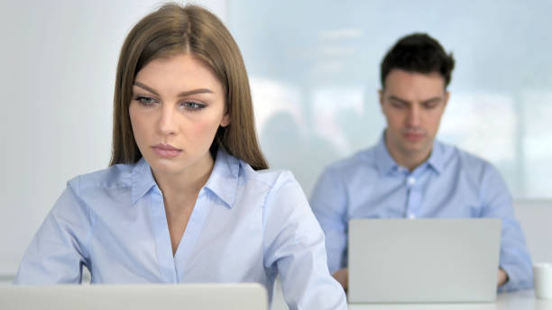 istock Young Businesswoman Working on Laptop in Office 1340717507