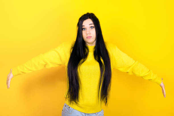 istock Surprised terrified female gestures with uncertainty 1340717722