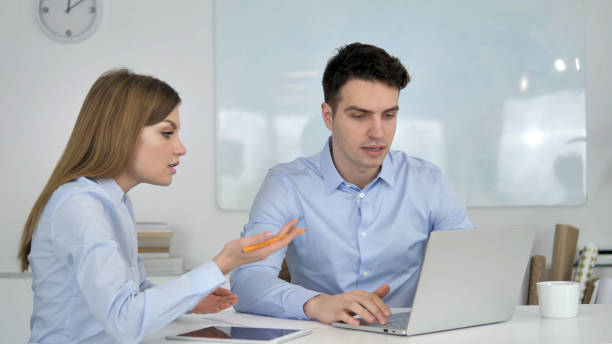 istock Young Business Colleague Explaining Online Project on Laptop 1340717822