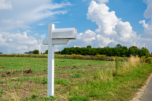 US mailbox in the countryside with sky background