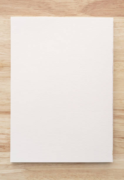 istock Watercolor paper texture on wood background with clipping path. 1340719134