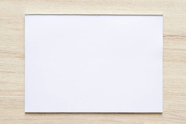 istock Watercolor paper texture on wood background with clipping path. 1340719168