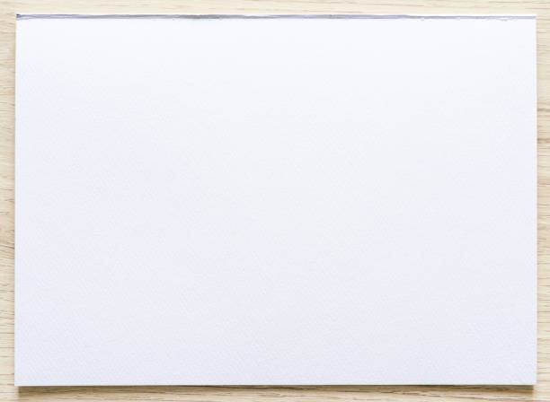 istock Watercolor paper texture on wood background with clipping path. 1340719173