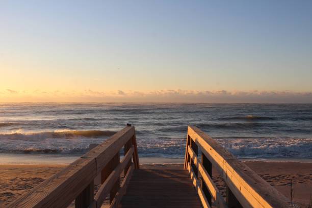 istock waves and sand at the beach at sunrise 1340720571