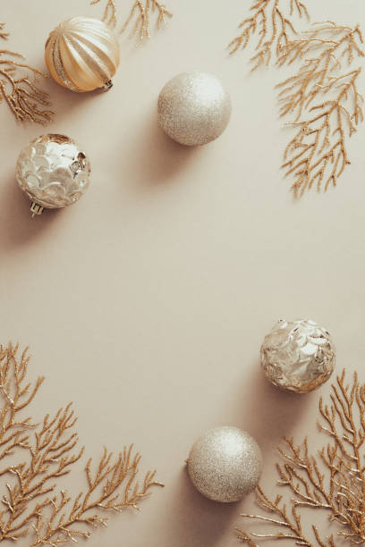 istock Christmas golden decorations on pastel beige background, flat lay. 1340720573