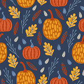 istock Autumn seamless pattern with pumpkins, oak leaves, seeds 1340722651