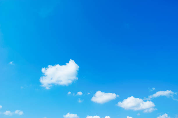 istock Blue sky background with the sun,Blue sky with white clouds floating in the sky. 1340724044