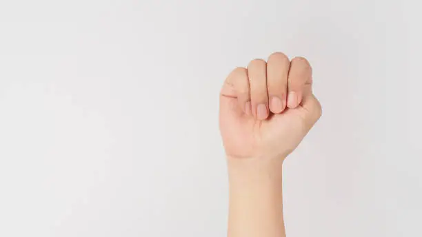 Signal for Help.Trap thumb hand sign on white background.