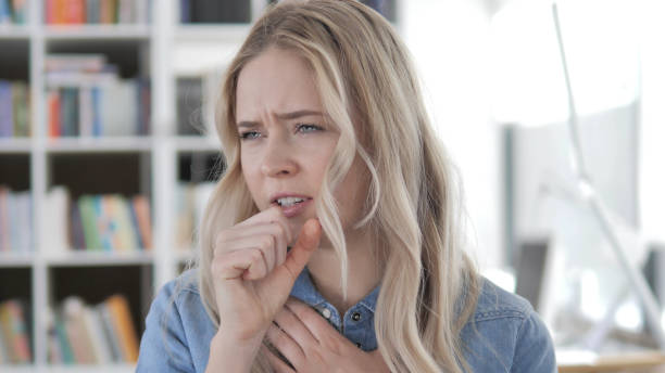 istock Cough, Sick Young Blonde Woman Coughing 1340730770