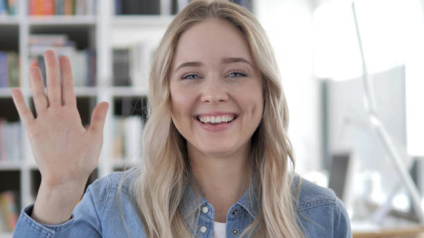 istock Young Blonde Woman Talking for Online Video Chat 1340731245