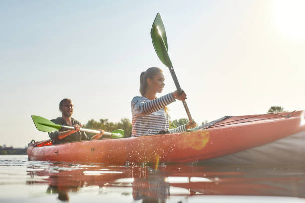istock Active young couple spending a day kayaking together in a boat on a river 1340732658