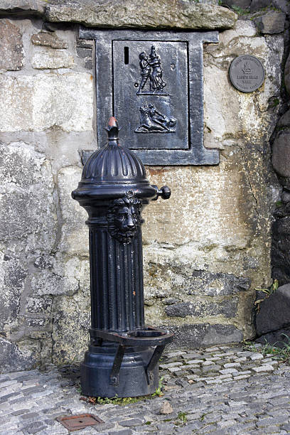 Old drinking fountain or well stock photo