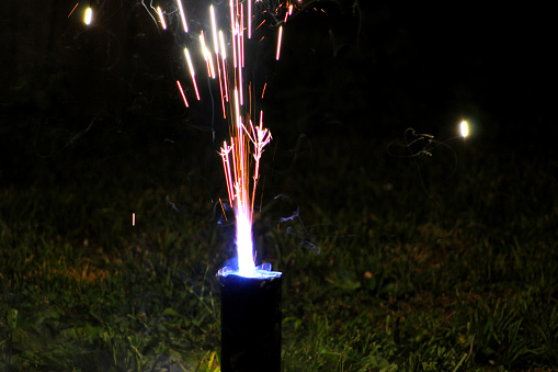 Roman Candle Firework going off in a yard