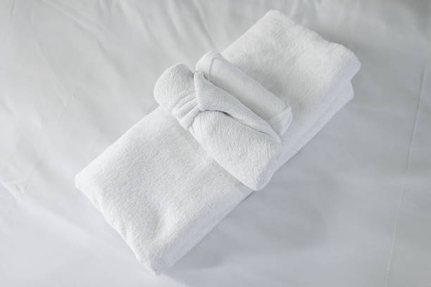 istock close up White towel on bed decoration in bedroom 1340736407