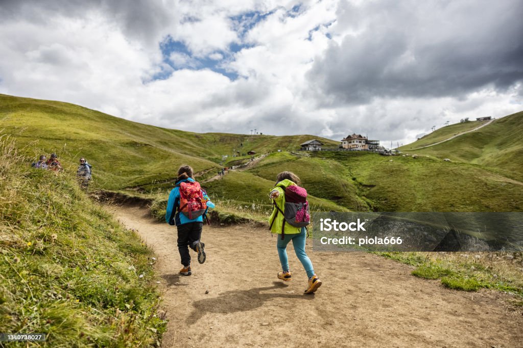 Family with children hiking on the Dolomites: outdoor adventures Dolomites Stock Photo