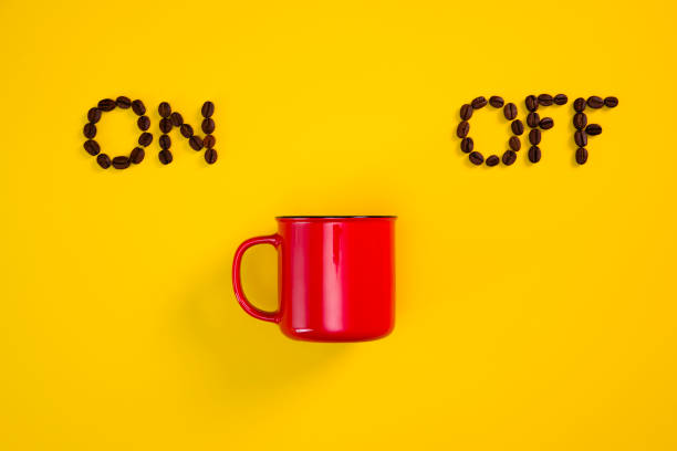 istock Cup of espresso coffee and on off power switch 1340738398