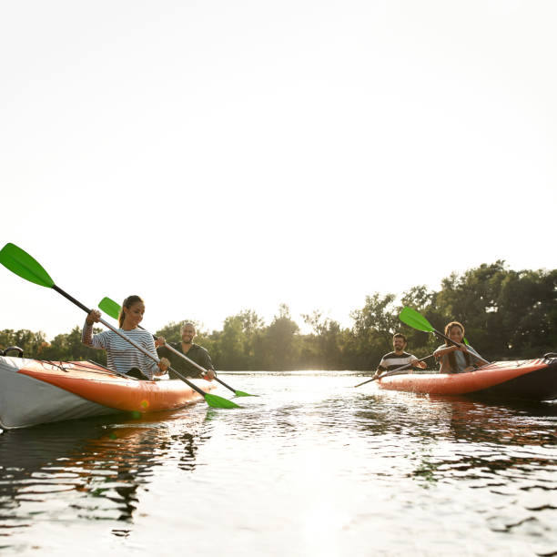 istock Restless young friends kayaking together on a river, spending weekend outdoors on a summer day 1340738458