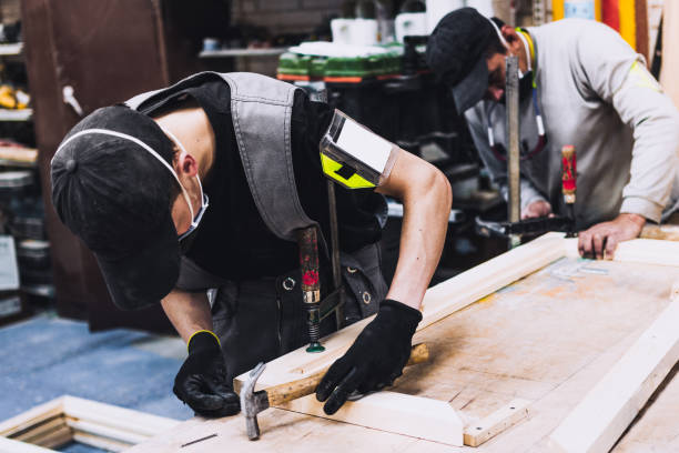 istock young man and senior man working with wood 1340738745