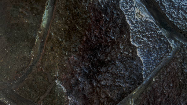 istock Scary dark walls, slightly light black concrete cement texture for background 1340739989