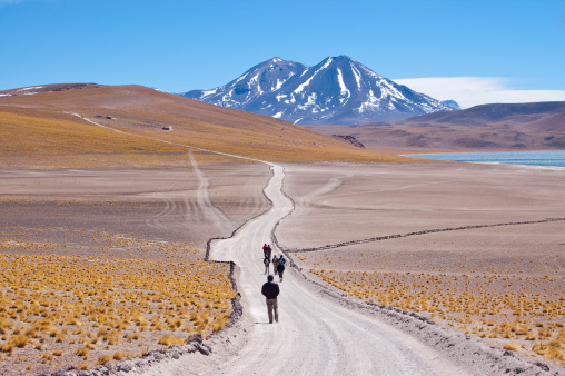 Tourists walking in chilean high plateau