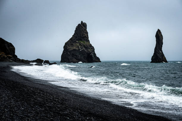 reynisdrangar in iceland - rain snow sun beauty imagens e fotografias de stock