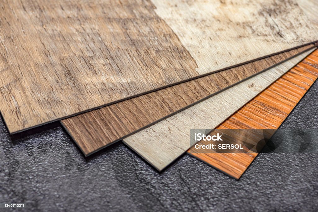 PVC resin vinyl sample, floor design choice with copy space. Easy installation of heated vinyl flooring Flooring Stock Photo
