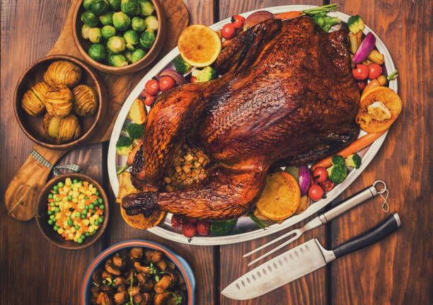 istock Traditional Stuffed Turkey Dinner with Side Dishes for Thanksgiving Celebration 1340749546