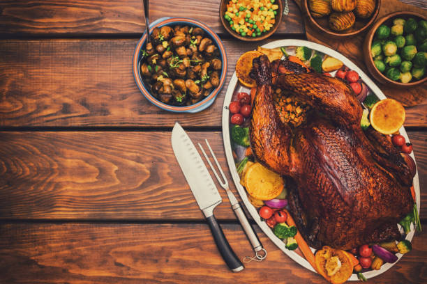 istock Traditional Stuffed Turkey Dinner with Side Dishes for Thanksgiving Celebration 1340749819