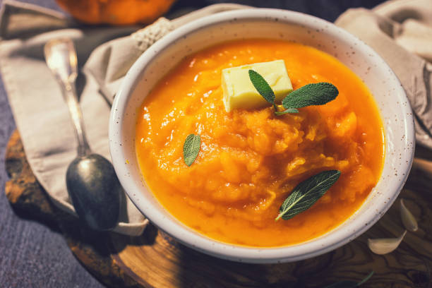 istock Homemade pumpkin cream soup with sage 1340750085