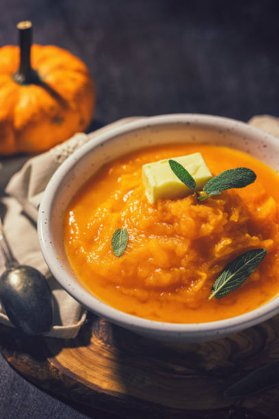 istock Homemade pumpkin cream soup with sage 1340750093