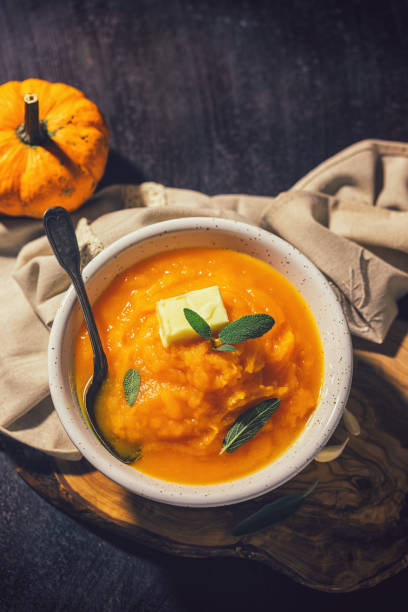 istock Homemade pumpkin cream soup with sage 1340750096