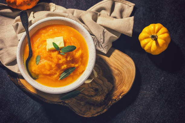 istock Homemade pumpkin cream soup with sage 1340750099