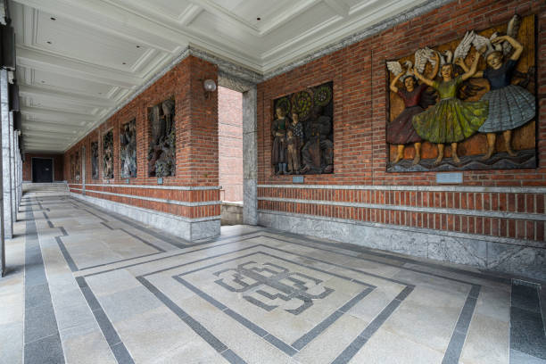 Oslo, Norway. September 2021. the wooden sculptures on the external walls of the  City town hall in the city center