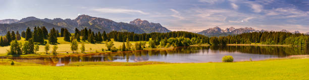 istock panoramic landscape in region Allgaeu with mountain range, lake and maedow 1340753692