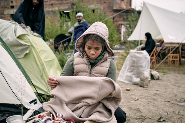 istock Sad Refugee Girl With Plaid 1340755860