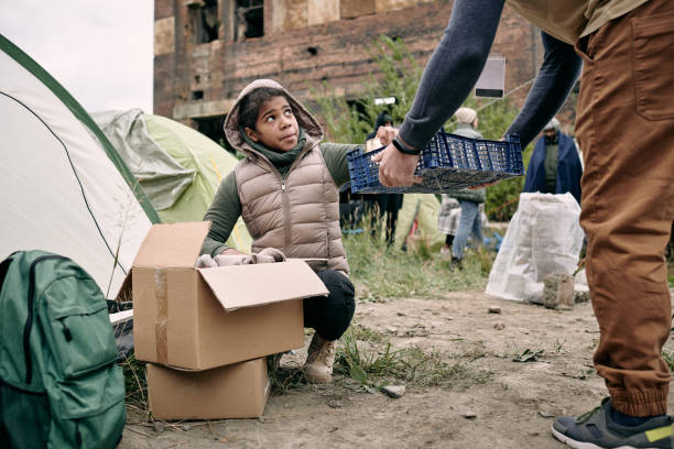 istock Refugees Collecting Food For Dinner 1340755875