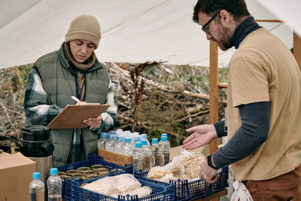 Distributing Food To Refugees stock photo
