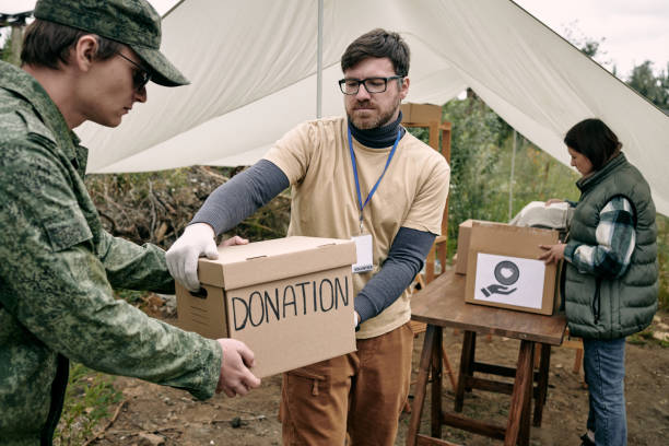 istock Passing Donation Box To Soldier 1340758249
